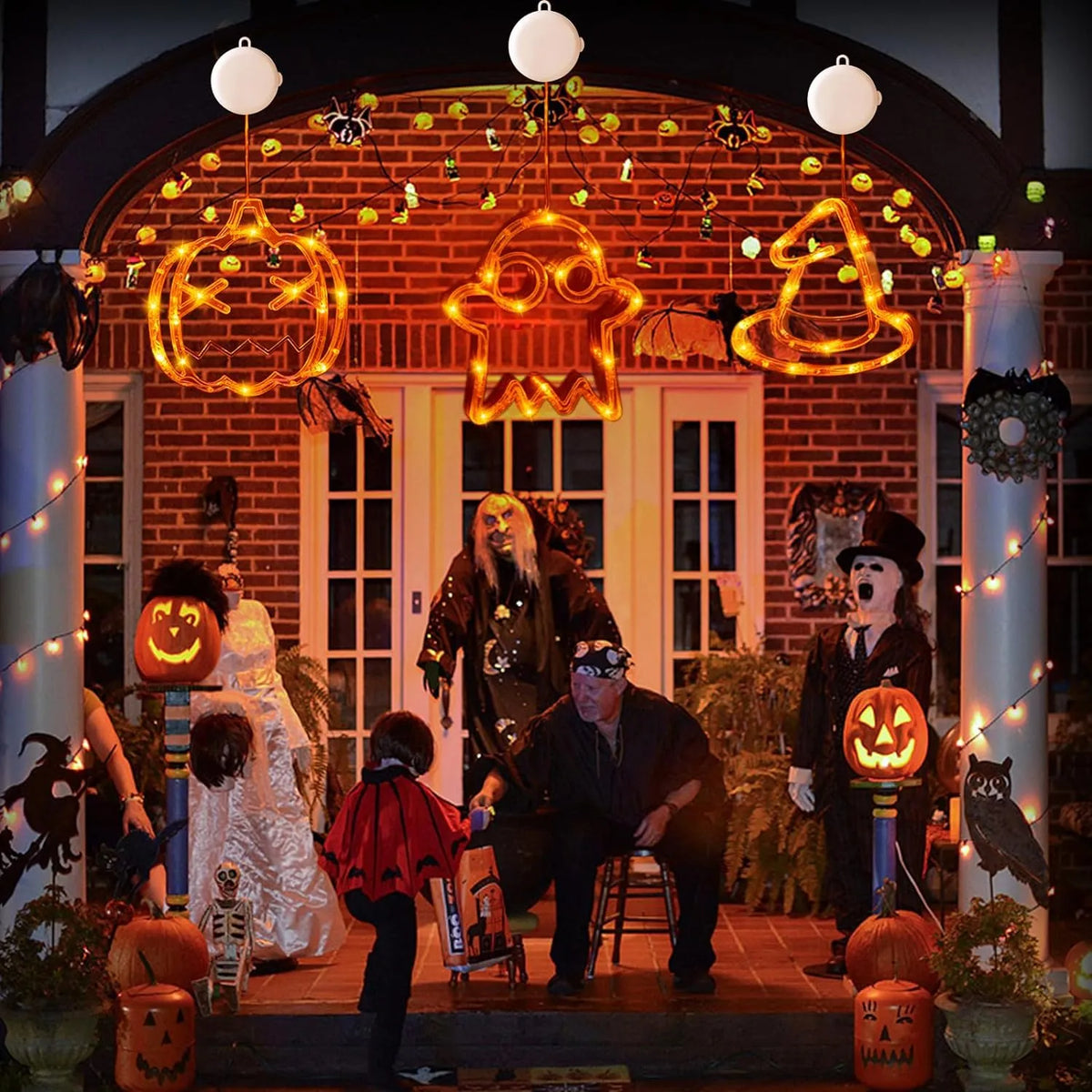 Halloween party display with hanging pumpkin, ghost and witch hat lights