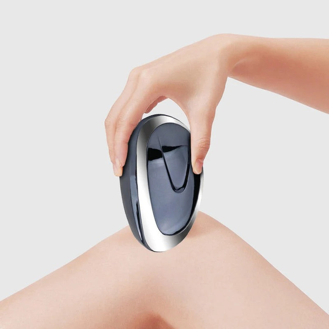 Dark blue hair-removal tool used on a leg