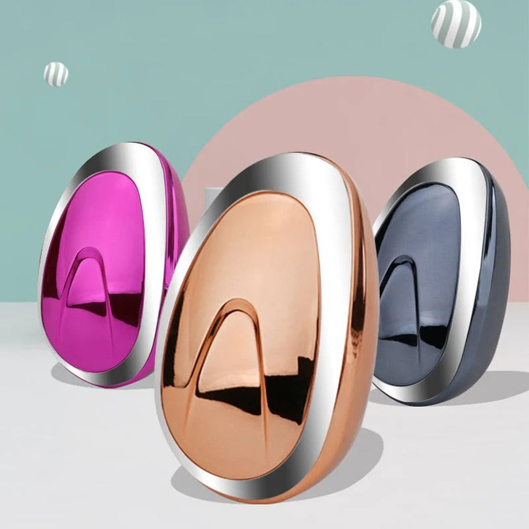 Three oval hair-removal tools in different colors