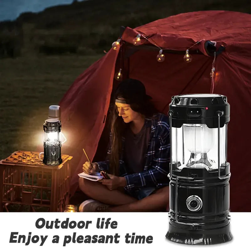 Black lantern beside tent and camper