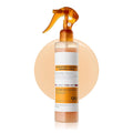 Body exfoliating spray with an orange trigger nozzle