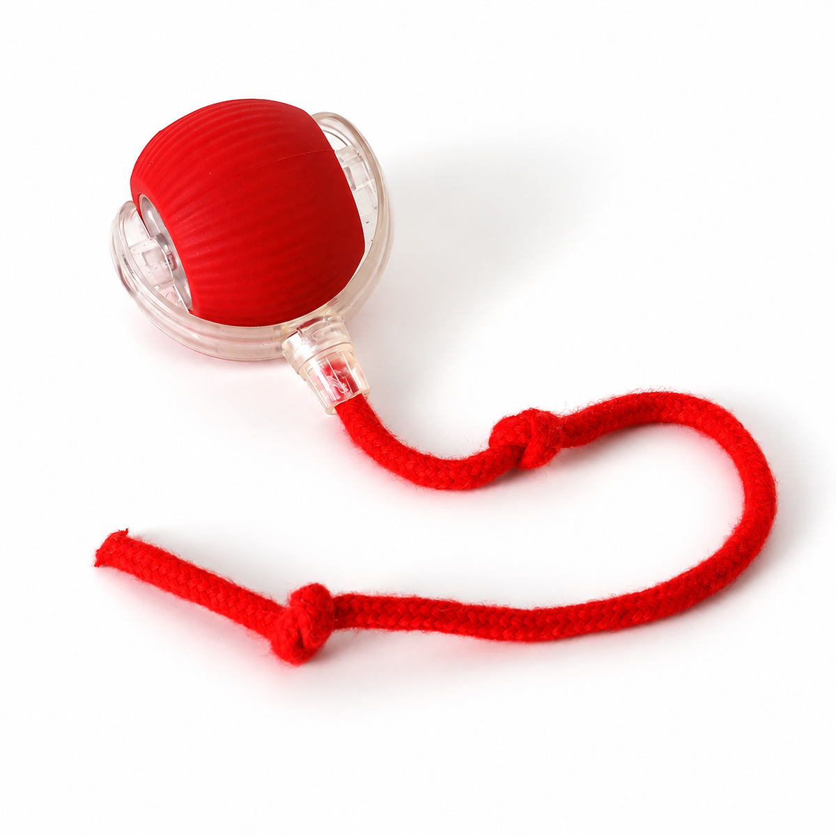Red rolling ball pet toy with matching rope on a white background