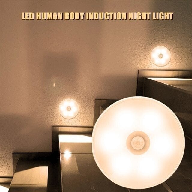 Warm LED motion sensor night lights alongside stairs