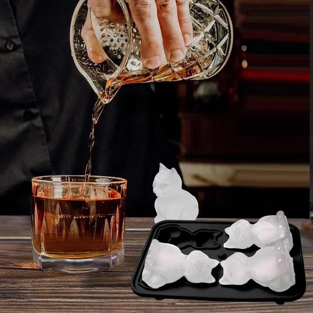 Cat-shaped ice and a drink being poured at a home bar
