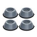 Four anti-vibration washing machine pads on a white background