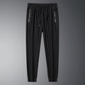 Front view of black pants with cuffed hems