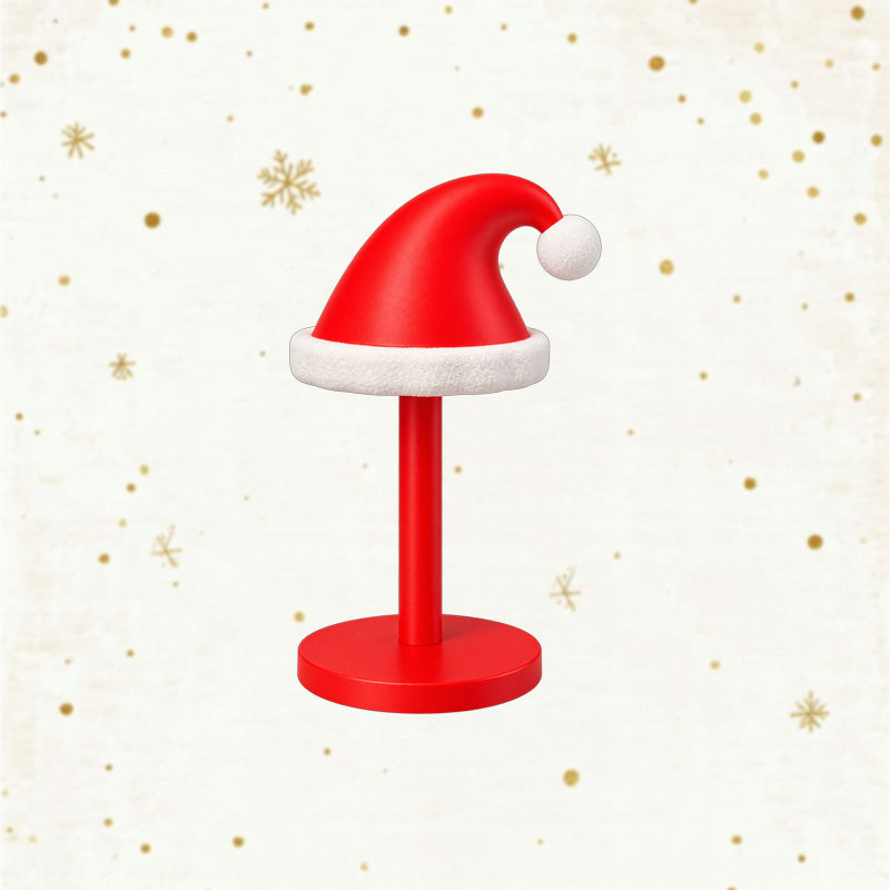 Red Santa hat paper towel holder stand on a light background