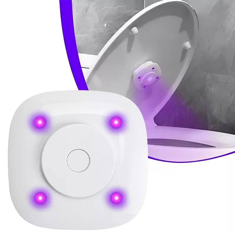 Four-light toilet UV accessory beside a toilet lid