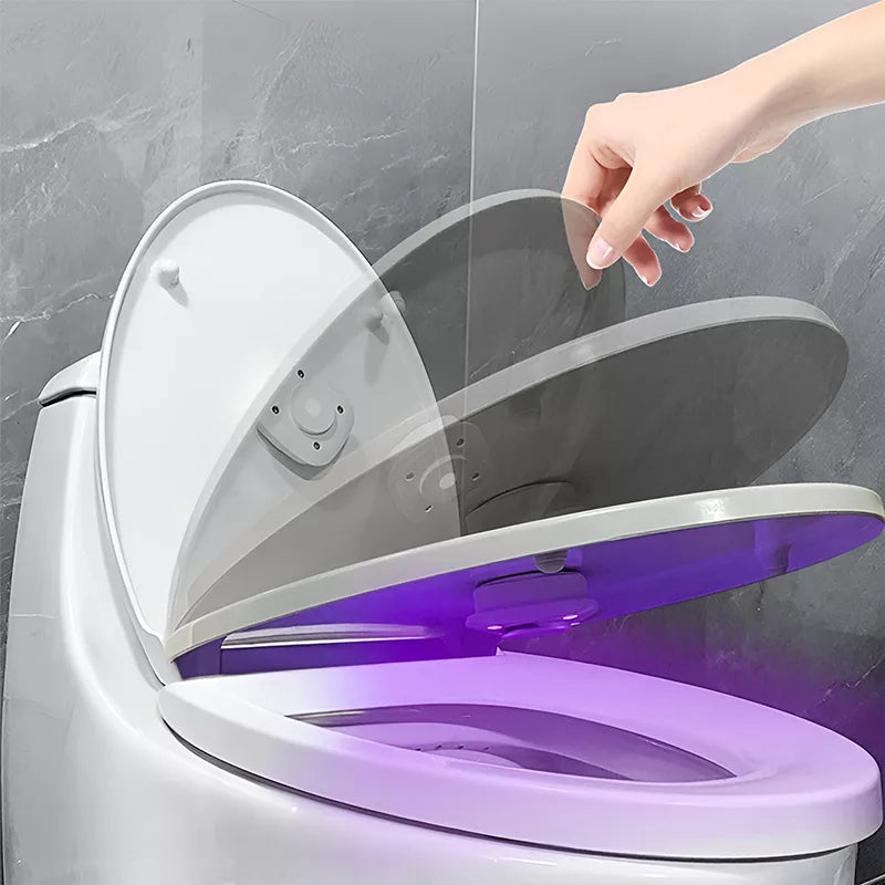 Toilet lid with compact UV accessory mounted beneath