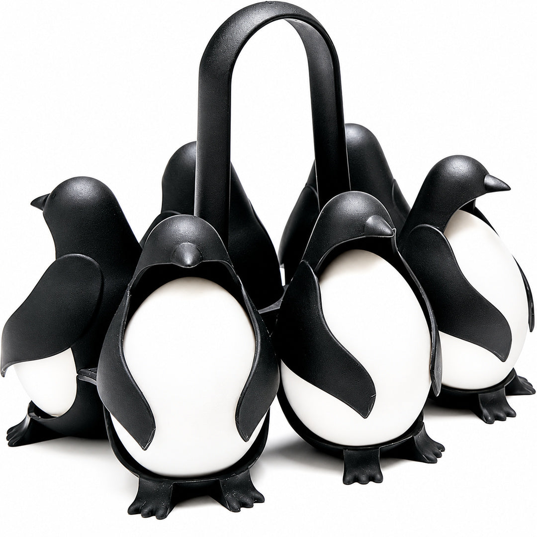 Penguin-shaped holder with eggs on white background