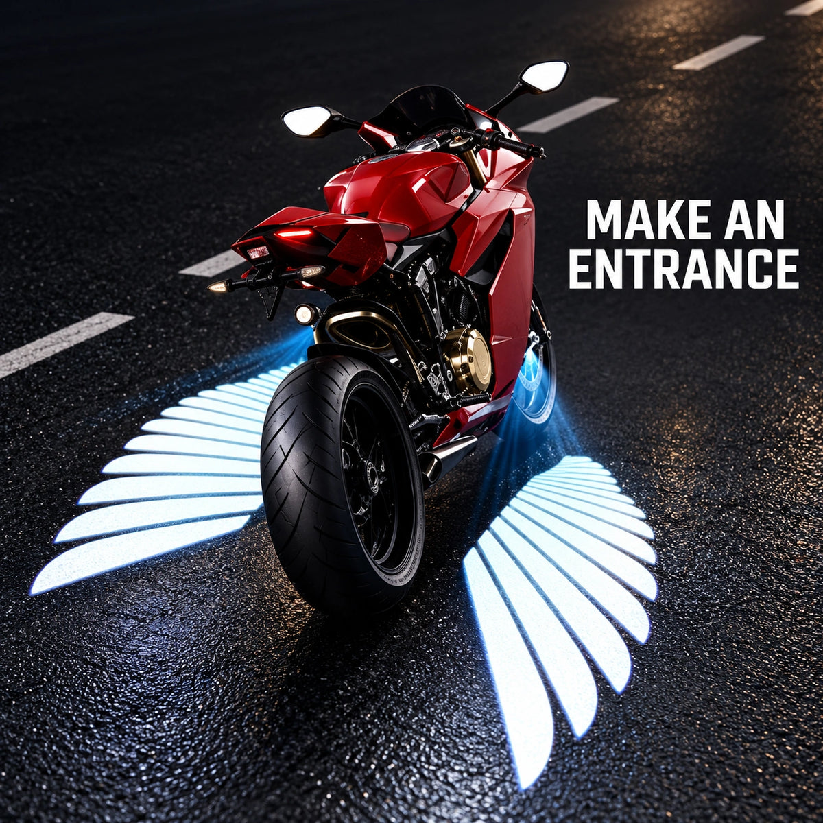 Red motorcycle parked with illuminated angel wing projection